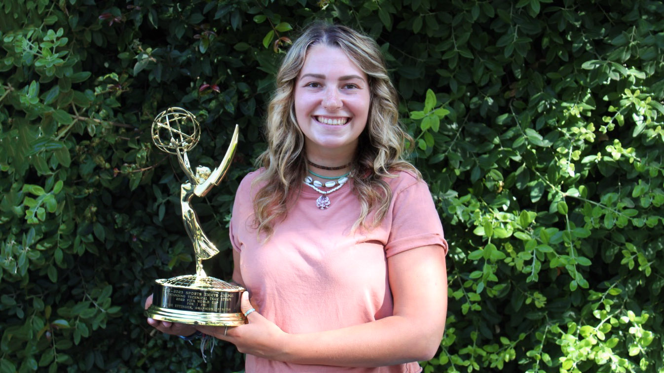 Kaylee Ettinger holding Emmy Award