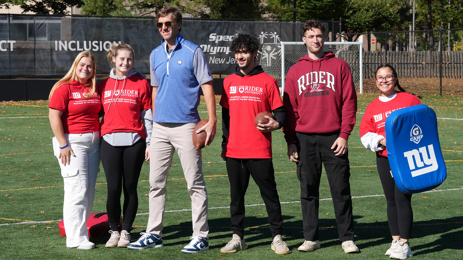 Rider students and Eli Manning