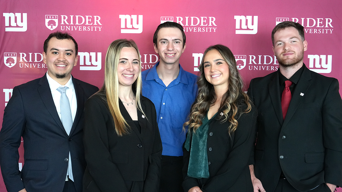 Students posing after presentation to Giants' front office staff