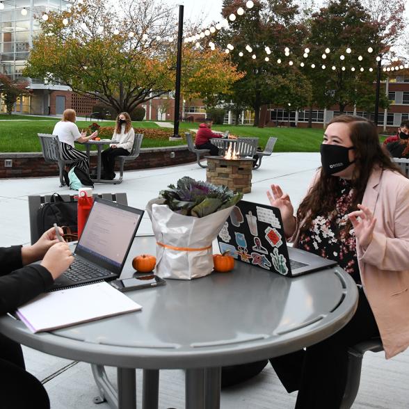 Masked students on Rider's campus