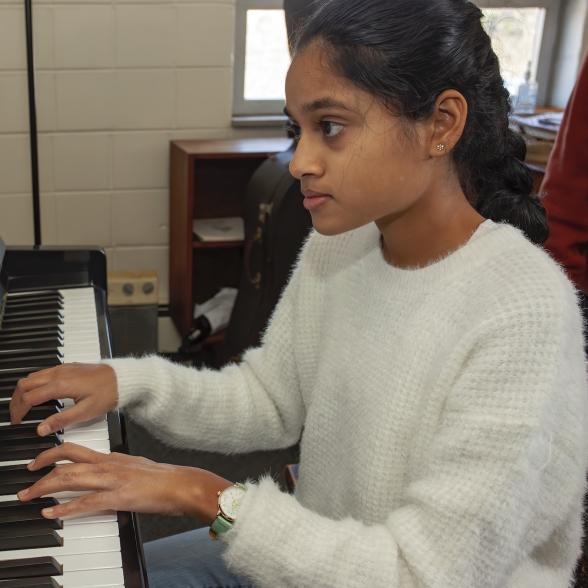 Conservatory student plays the piano.