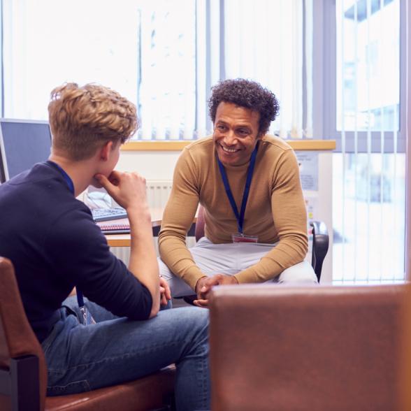 Counselor and student talk in office