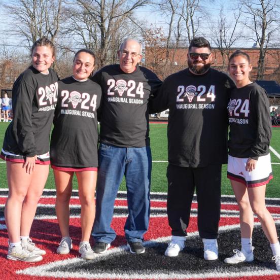 Alan Gurwitz poses with Rider lacrosse players and coach
