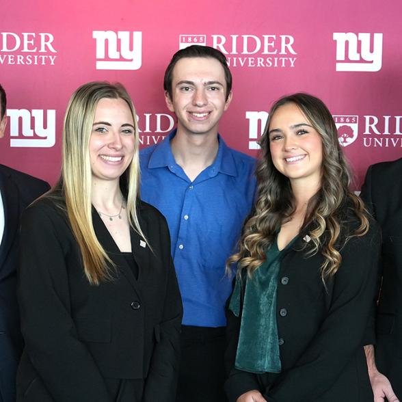 Students posing after presentation to Giants' front office staff 