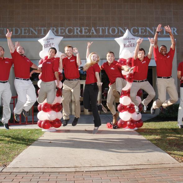 students jumping in celebration