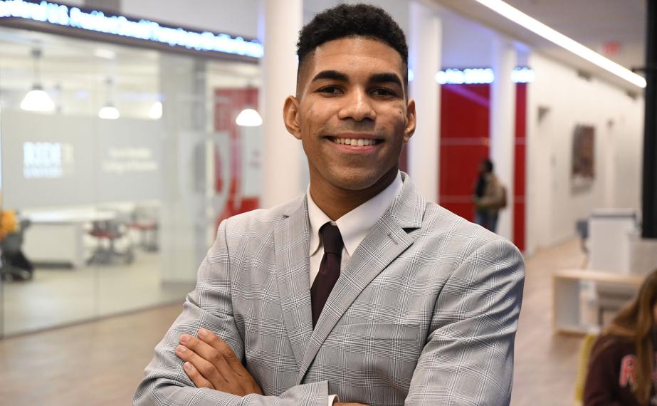 Business student with arms crossed