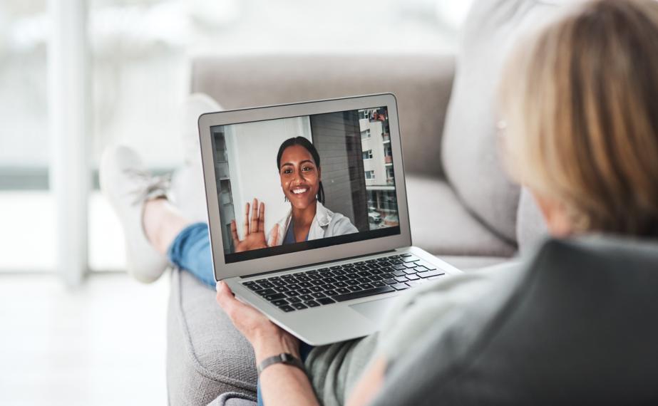 Healthcare provider speaks with woman over video call