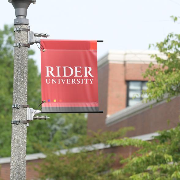 Norm Brodsky College of Business with Rider Flag