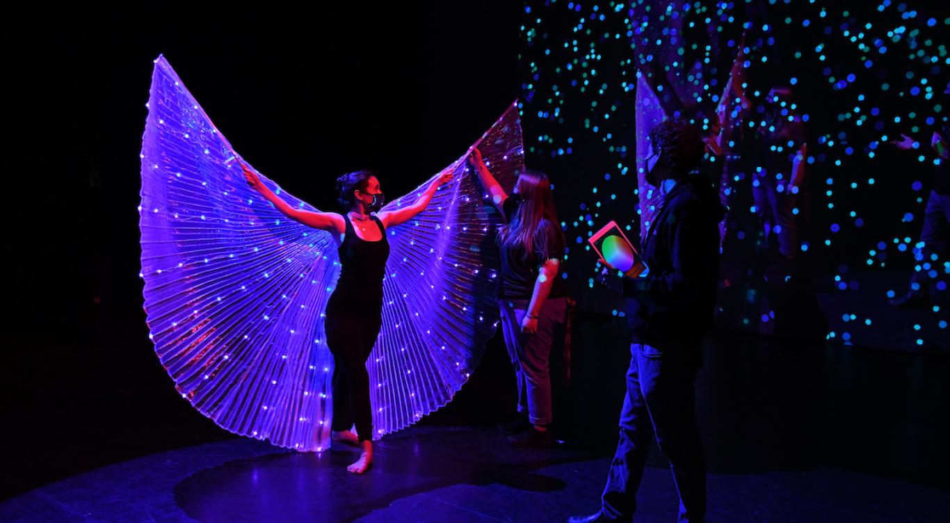 Students and faculty work with stage lighting technology