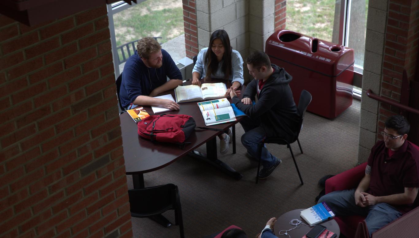 Students study together at a table