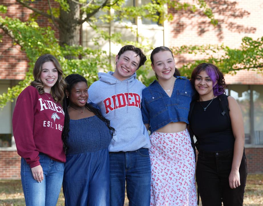 Students in Rider sweatshirts outside