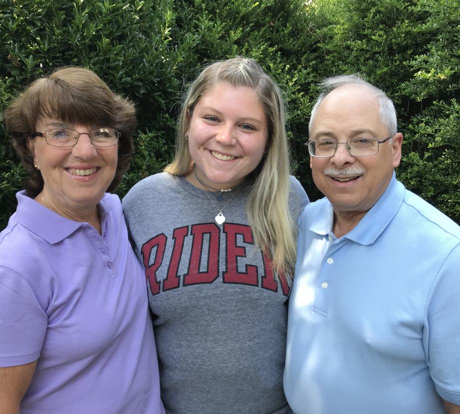 Rider student with her mom and dad