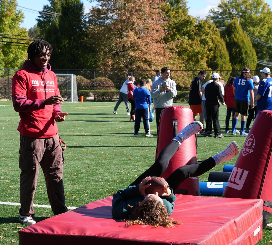 Rider student working with Special Olympics athlete