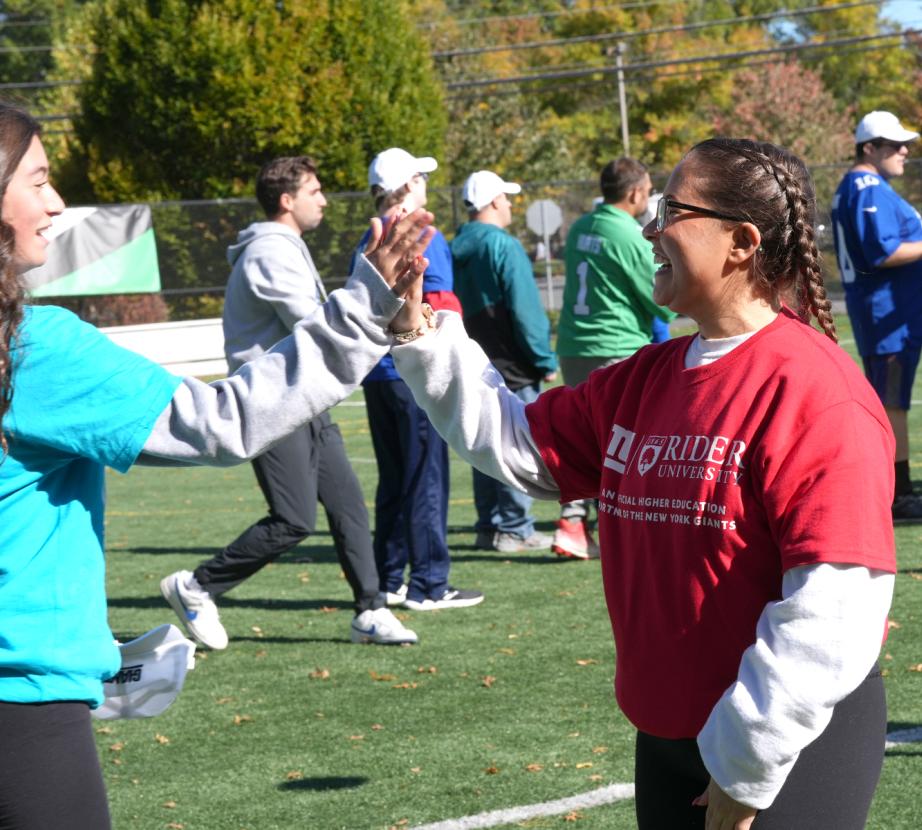 Rider student working with Special Olympics athlete