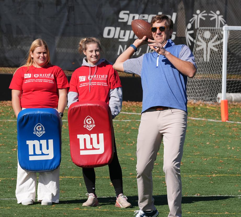 Rider students and Eli Manning