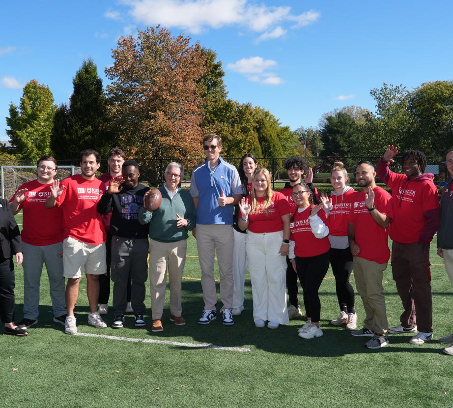 Rider students and staff with Eli Manning