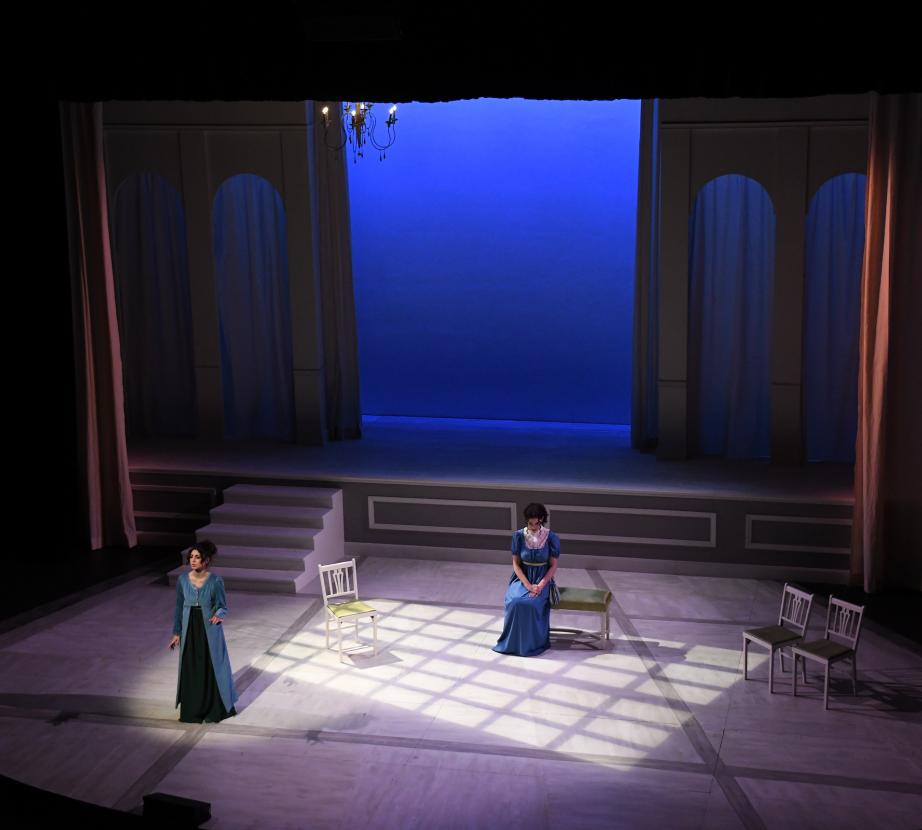 Students performing an opera on stage