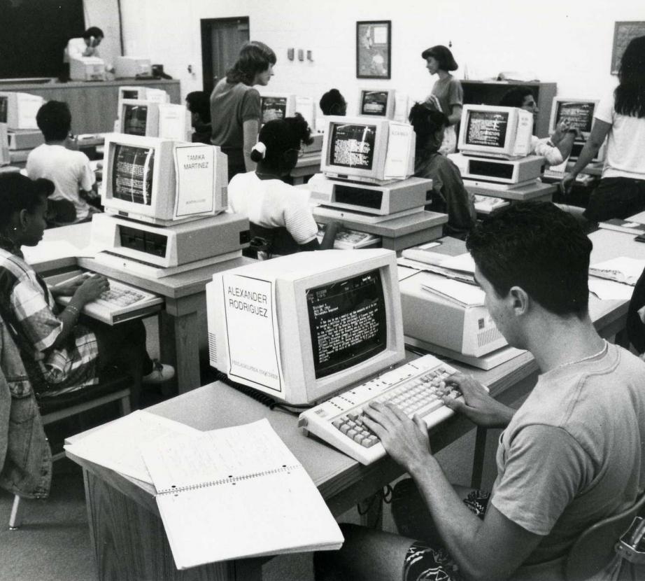 Old photo of people working on computers