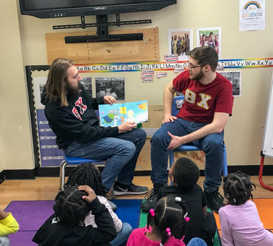 Students read to children.