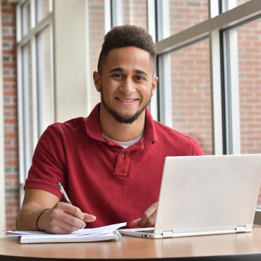 Ethan Dowie, Student, Sitting in front of a computer doing work