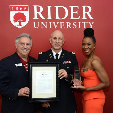 Col. Kenneth Tozzi '84 accepts the Conover Leadership Award